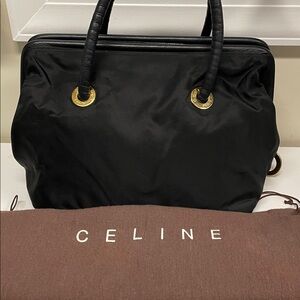Authentic Celine Elegant Black Handbag with Gold Accents